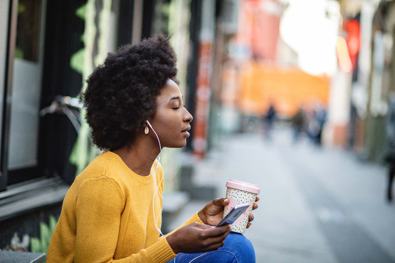 Listening to podcast on the street